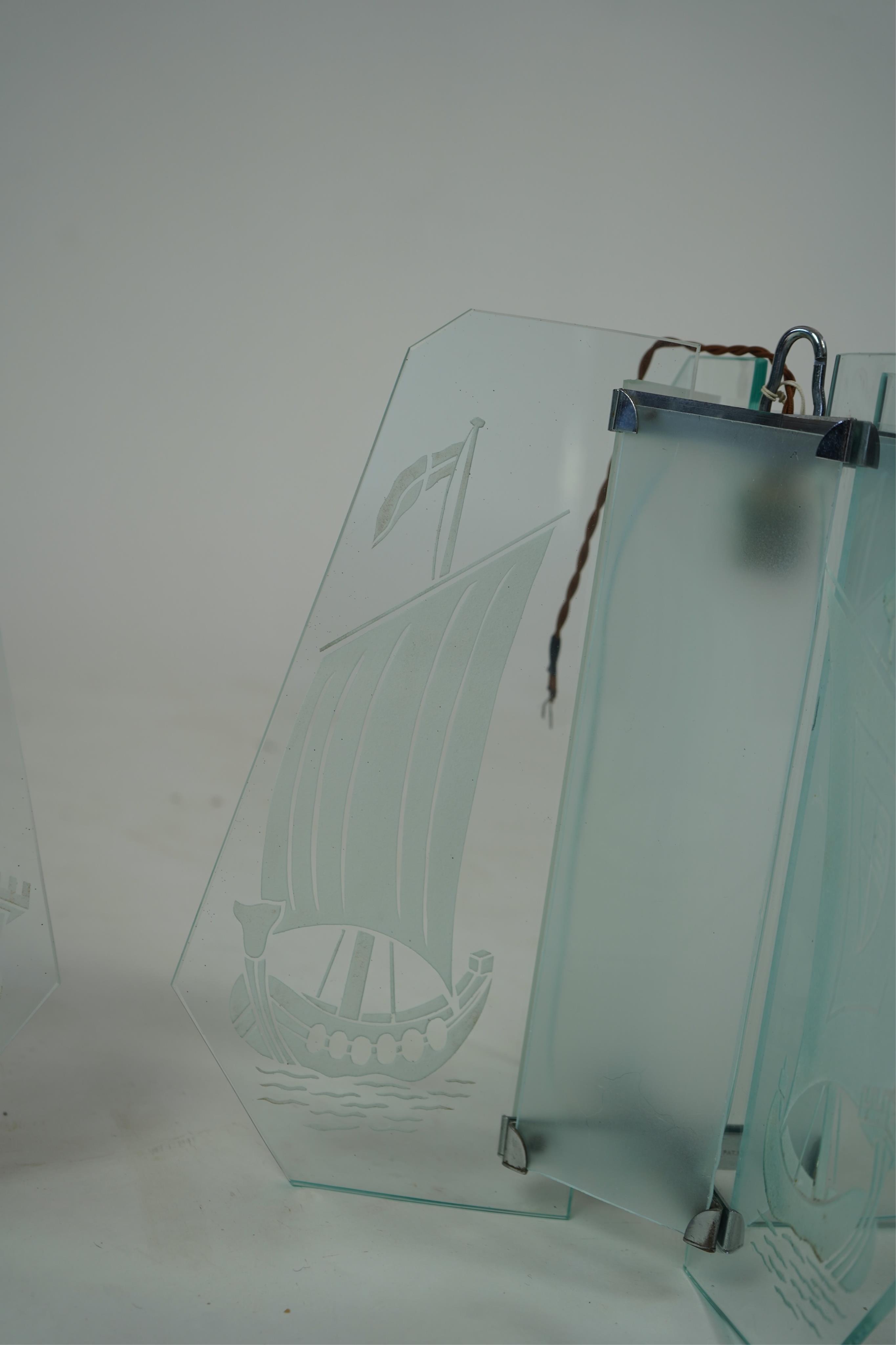 A pair of Art Deco chrome and four panelled etched glass ‘Galleon’ designed celling pendant lights